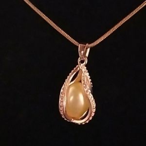 Akoya Pearl in a caged pendant necklace RG